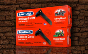 Gearhaul, Sawhaul Chainsaw Carrier Tube Mount & Sawhaul Tractor Mount cartons on dark tree bark background